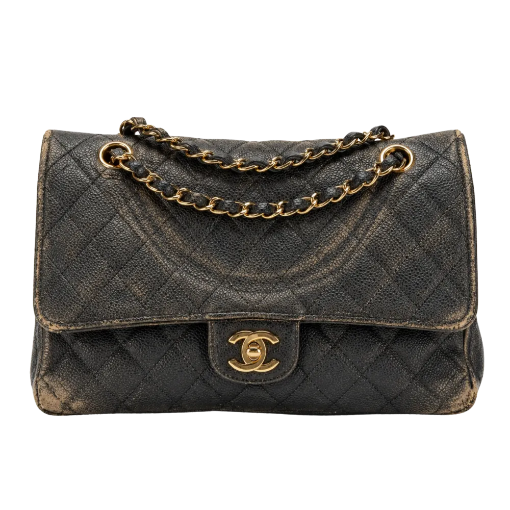 Black Chanel Classic Flap in poor condition with a slouched silhouette, discoloration, and chain marks.